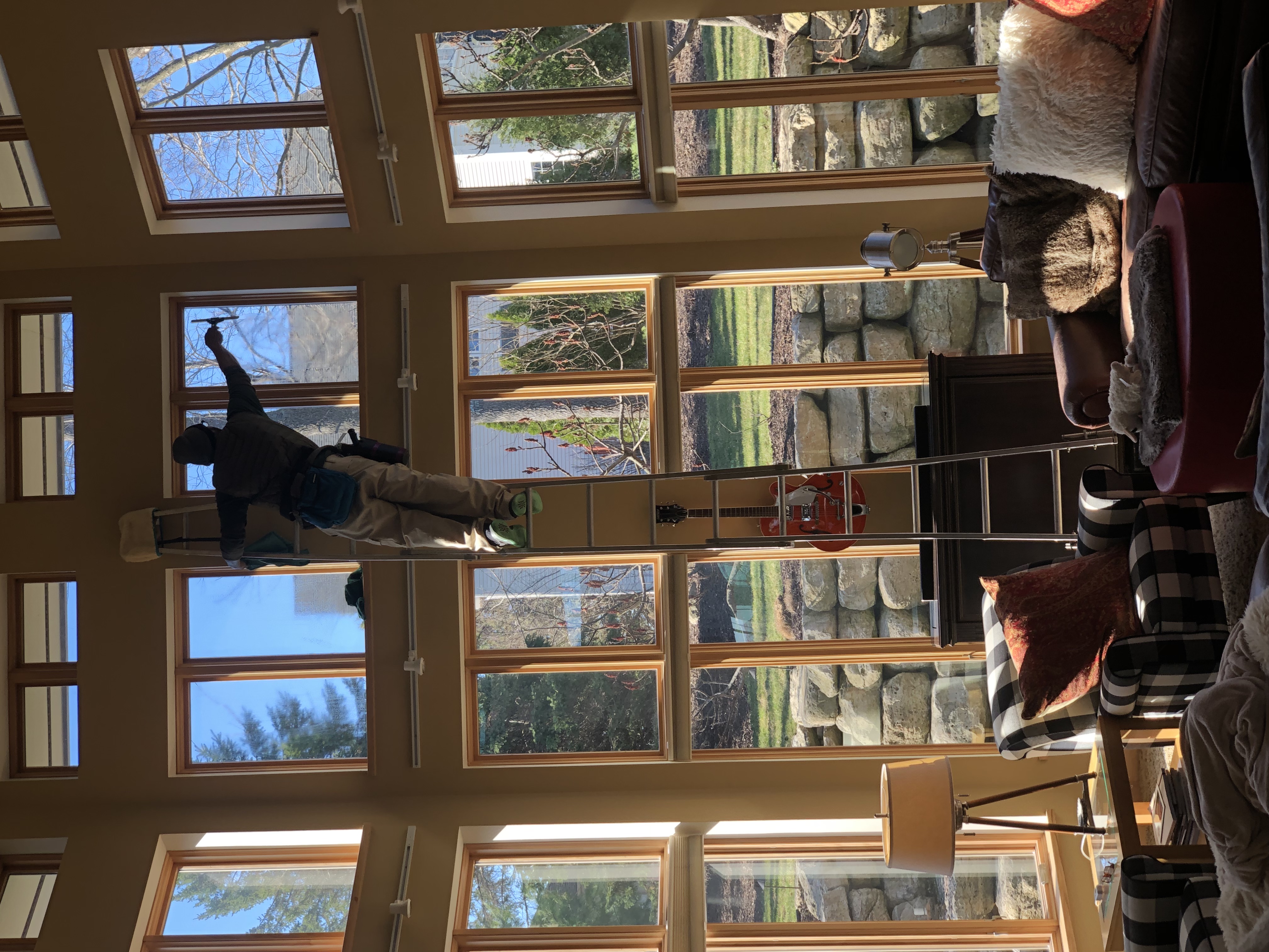 Interior window cleaning in beautiful home with panoramic views